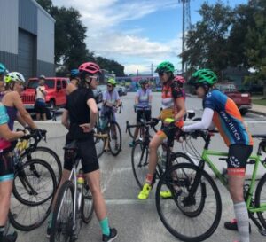 group of cyclists sitting on their bikes