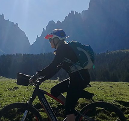 allison king rides her bike in the italian dolomites