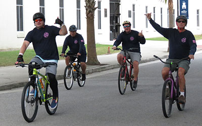 group of firefighters riding in lowvelo19