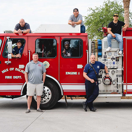 Isle of Palms firefighters sit in and on fire truck