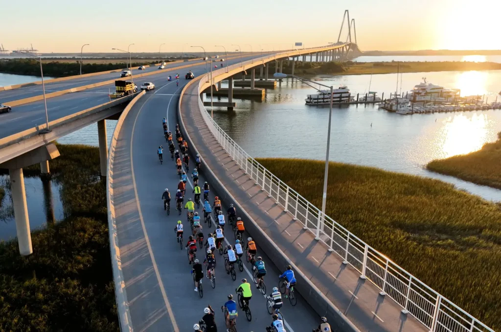 drone photo of cyclists riding over the Ravenel bridge