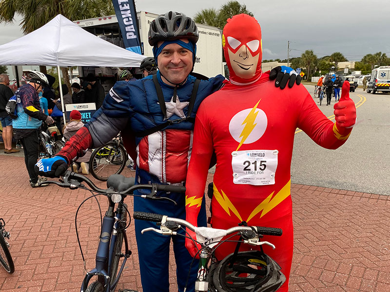 two riders wearing superhero costumes at Lowvelo21