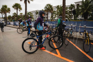 riders put their bikes in bike corral