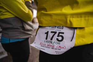 close up of rider bib that says I ride for Alice Wong (mom)