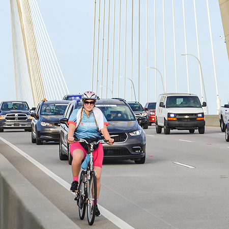 woman on bike on Ravenel Bridge
