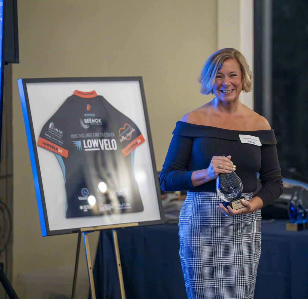 woman holding award