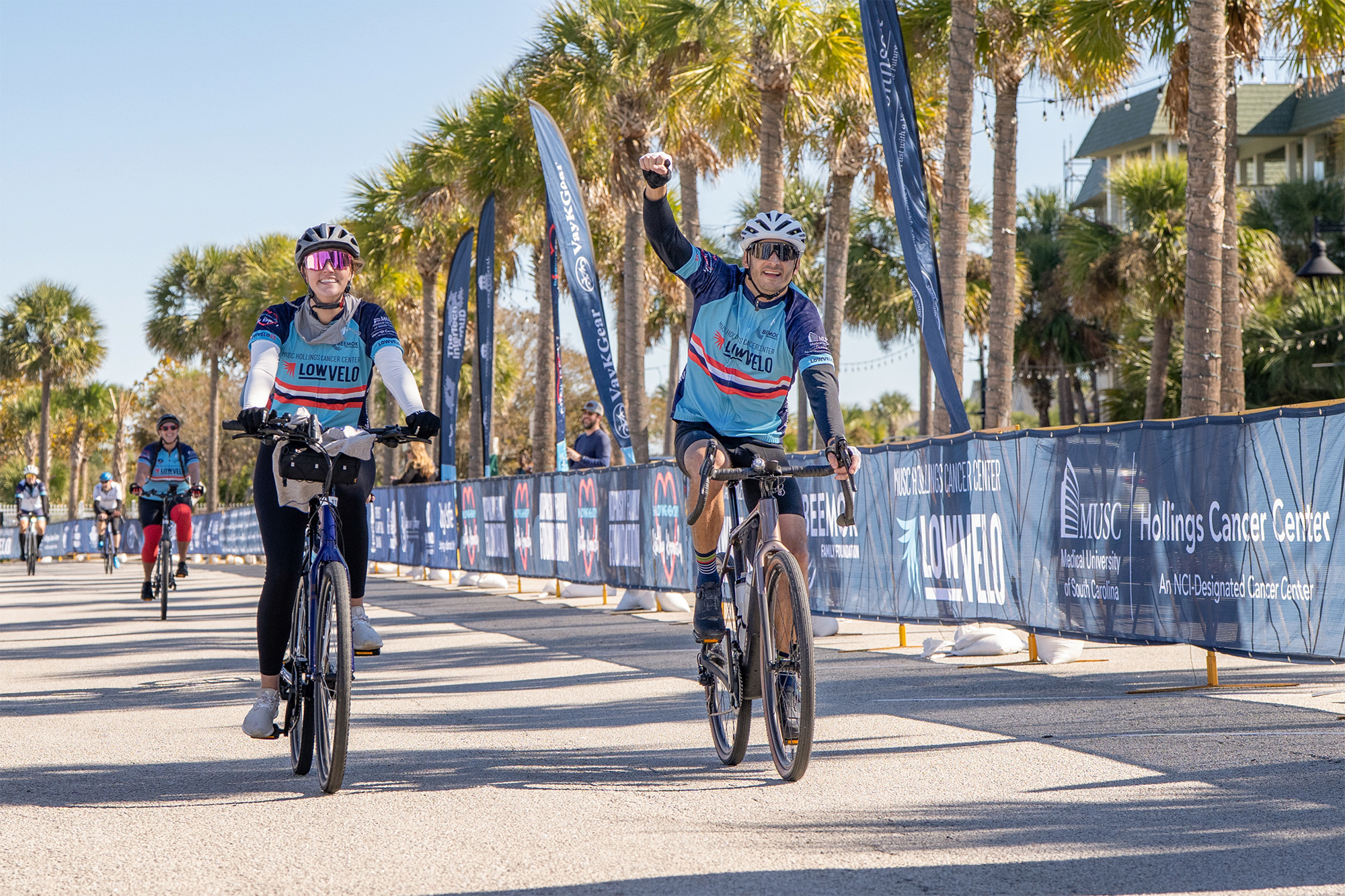 two cyclists cross the Lowvelo finish line