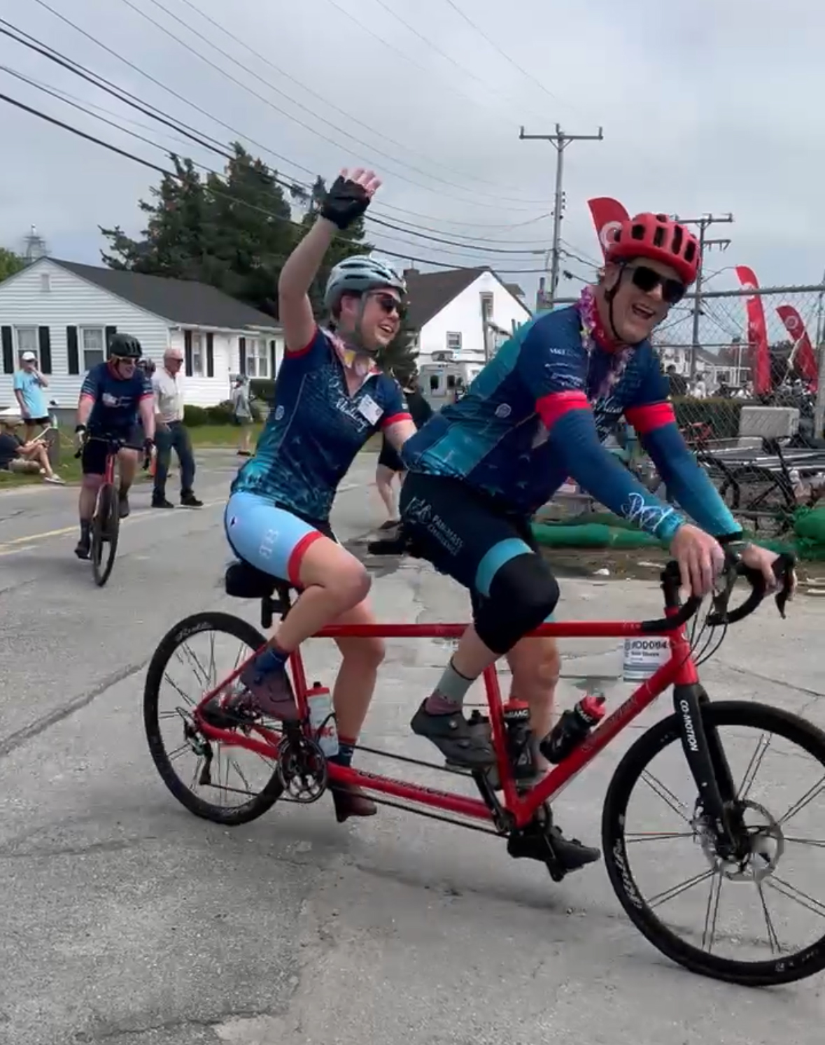 two people ride a tandem bike