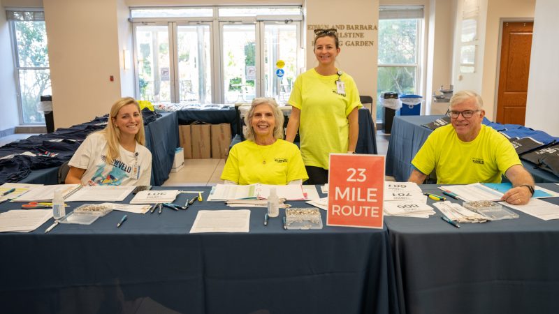 Volunteers at packet pick-up table