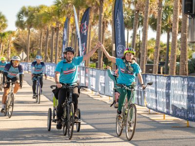 Cyclists crossing the Lowvelo finish line