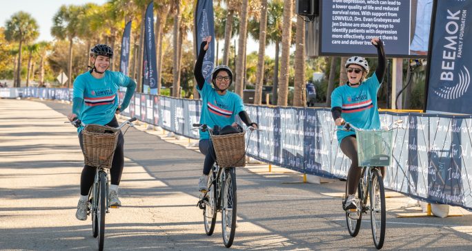 Cyclists crossing the Lowvelo finish line